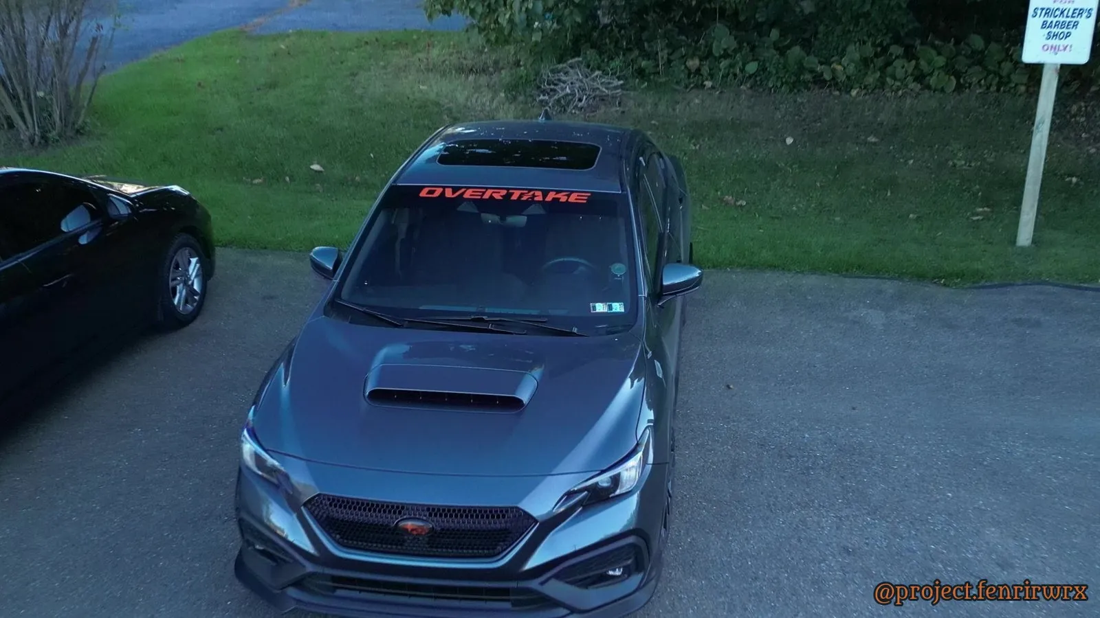 Drone shot of the front with the Overtake windshield banner