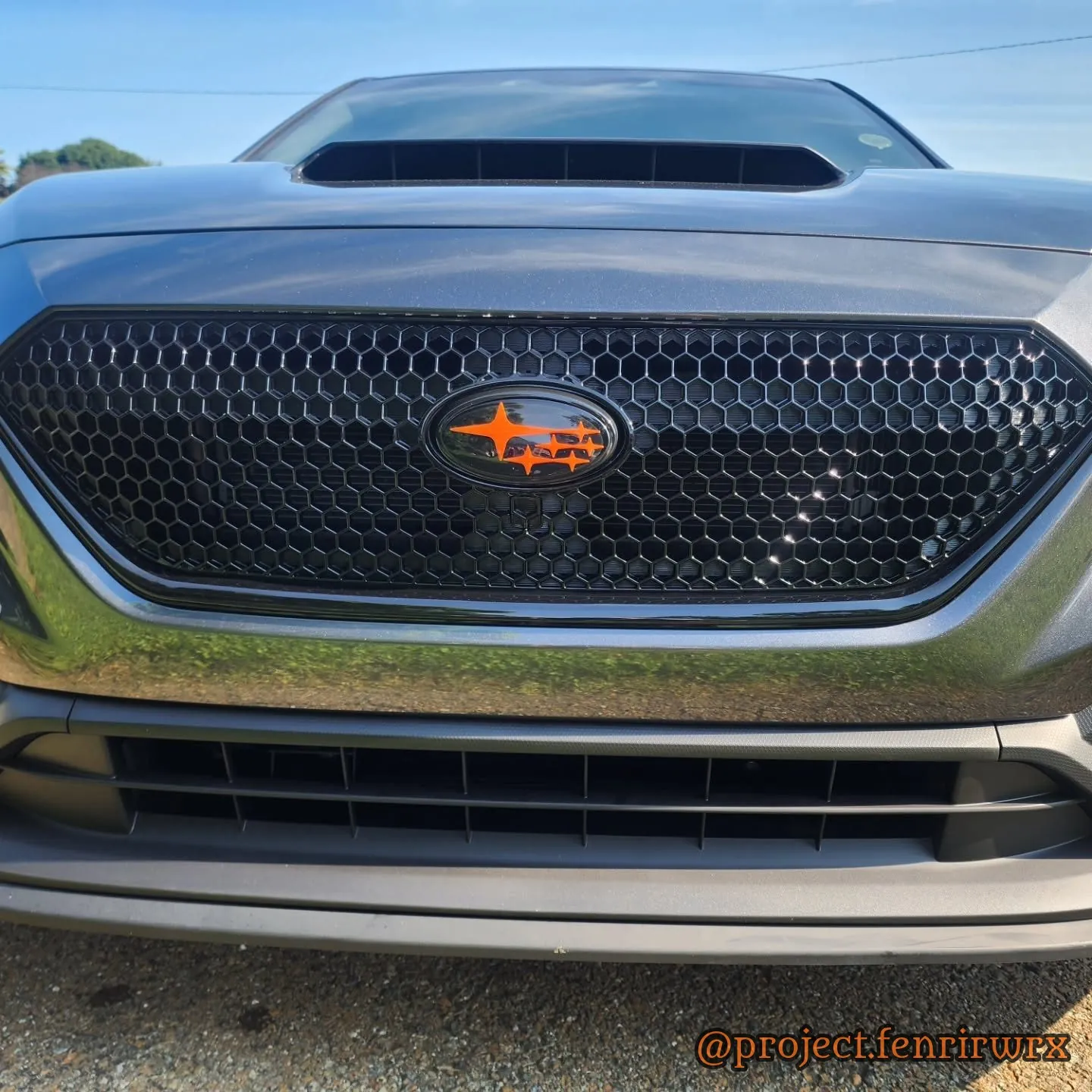 Grille and orange badge