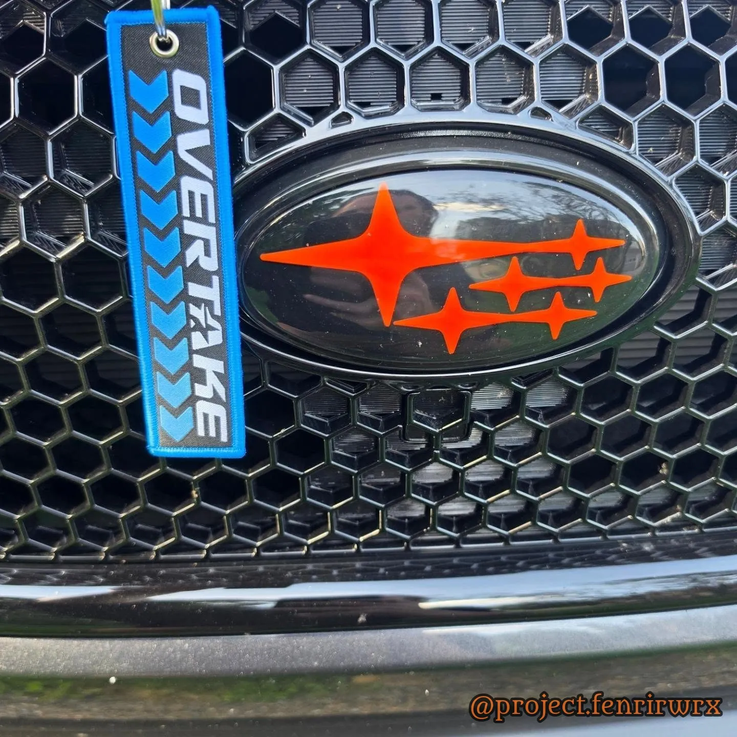 Overtake Sponsored Driver tag on the grille