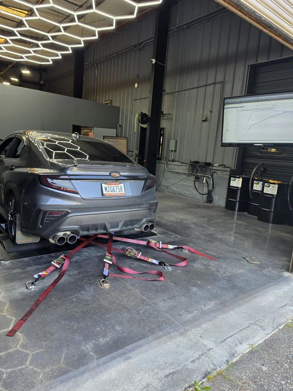 Car strapped down at the shop