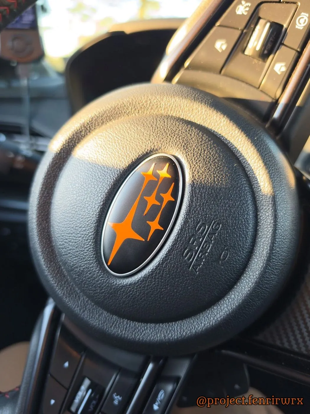 Orange stars on the steering wheel