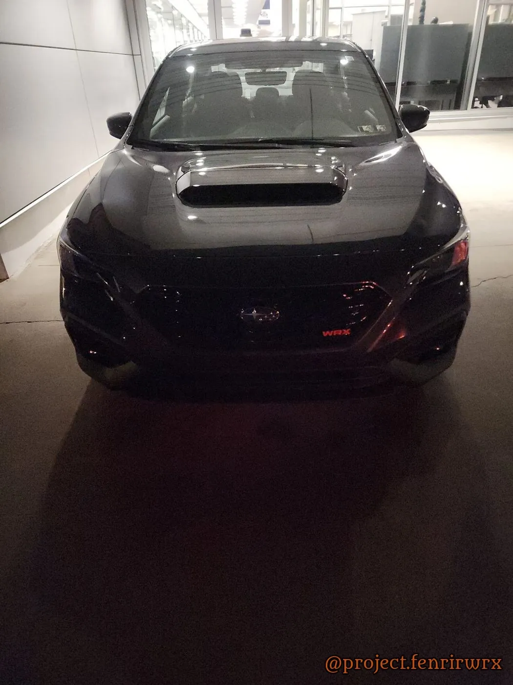 Delivery night under the showroom lights