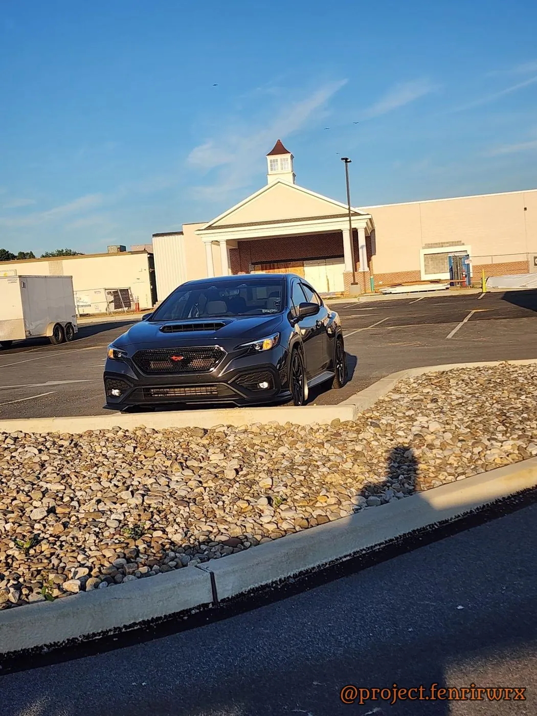Parked out front under a blue sky