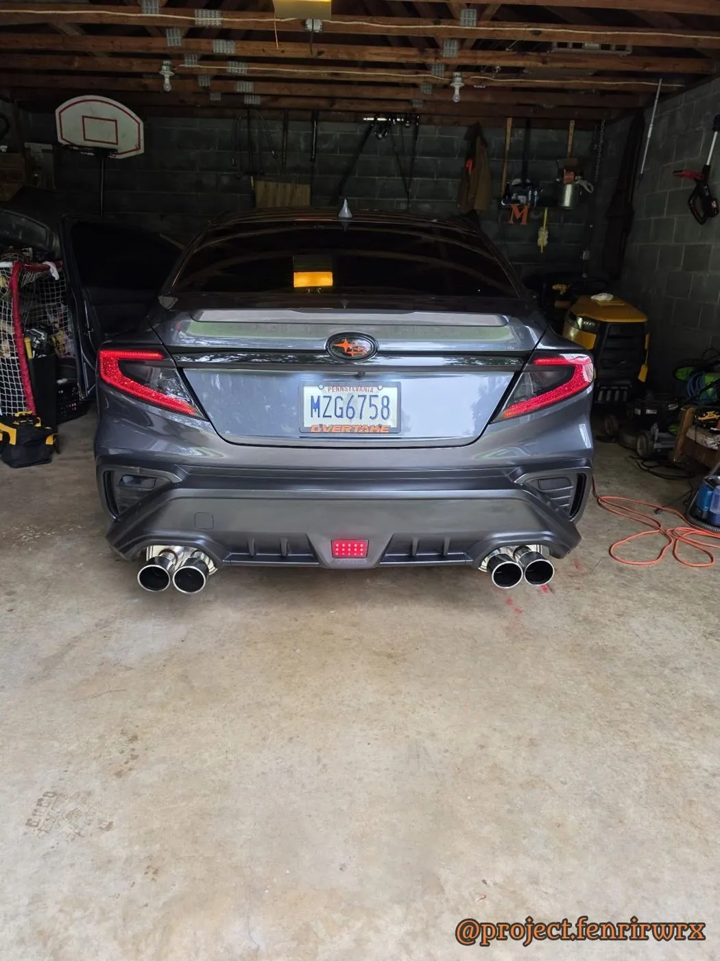 Rear in the garage with the door open