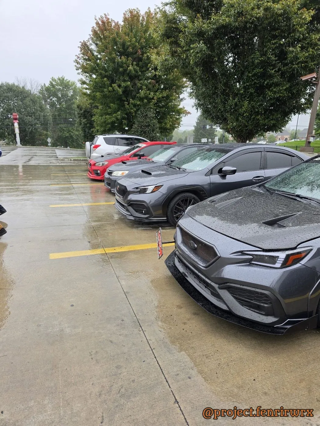 Rainy lot, Fenrir parked by the trees