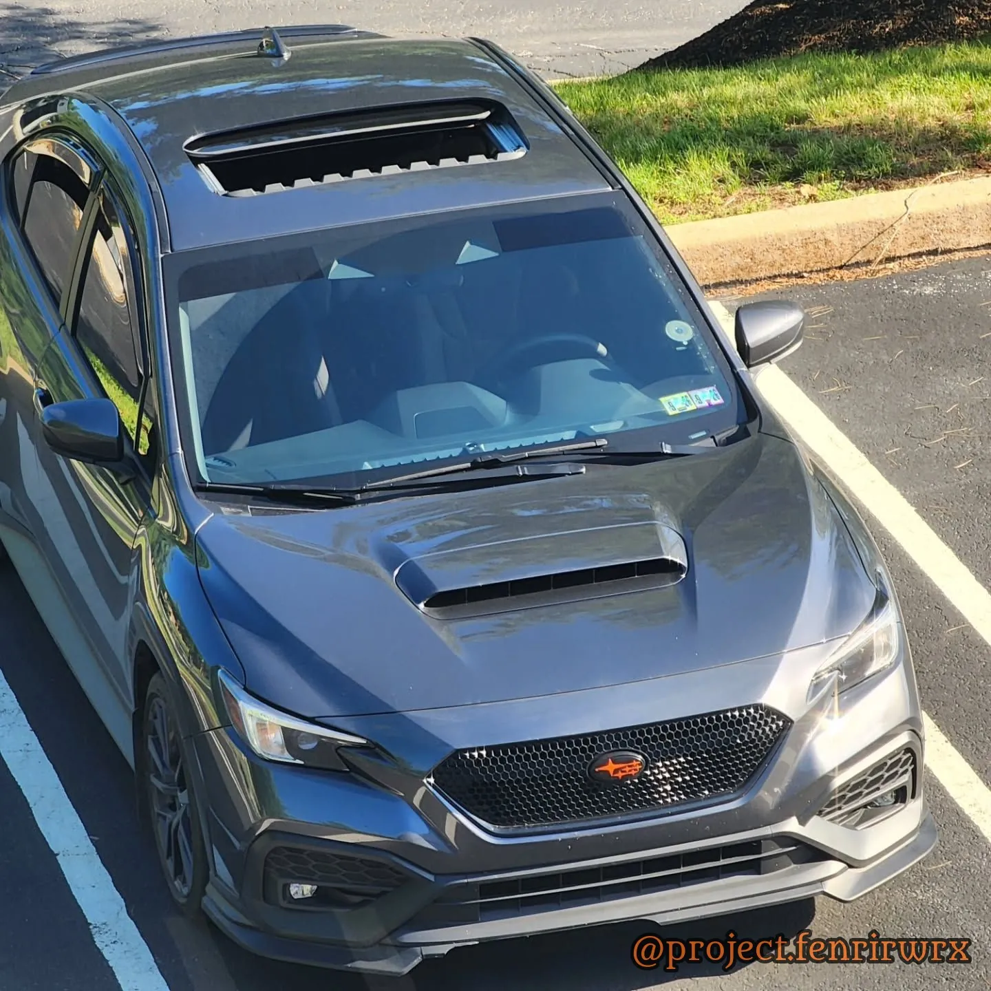 High front three-quarter showing the hood scoop