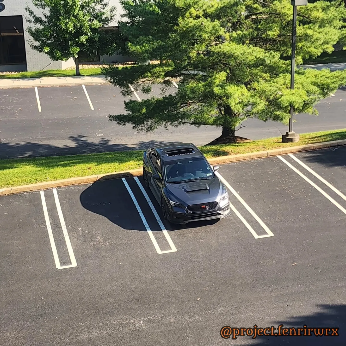 The car alone in an empty lot from above
