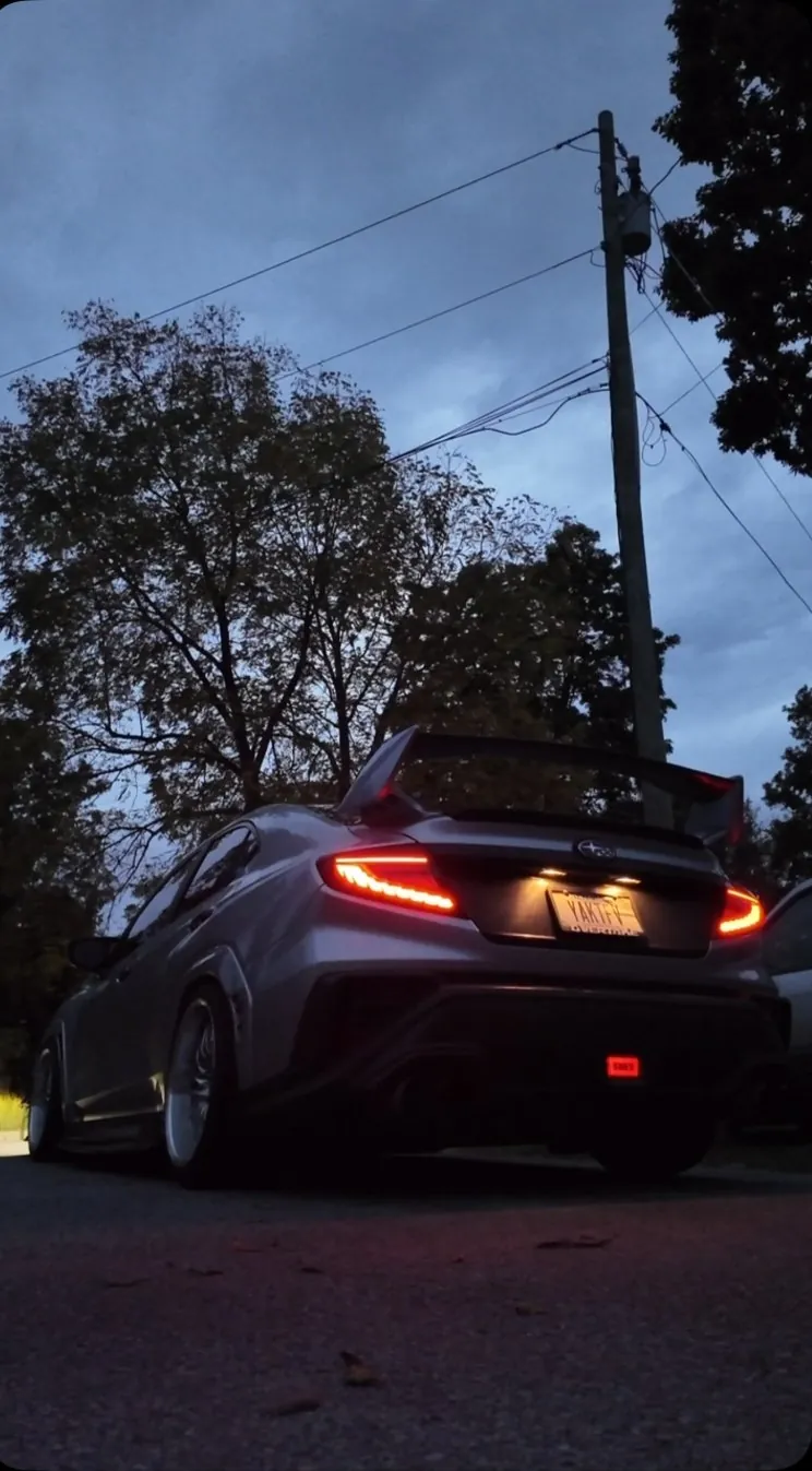 @6spdvb's WRX from behind at dusk, taillights on