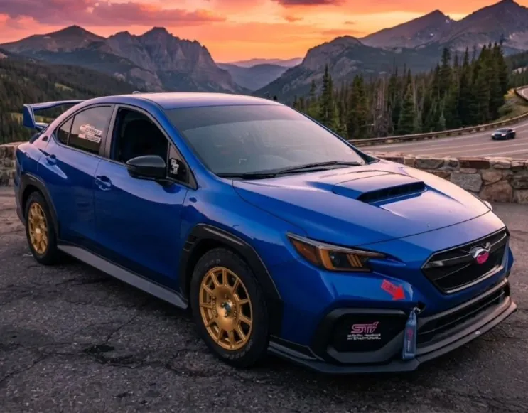 @90s_kid_subaru's WRX at a mountain sunset